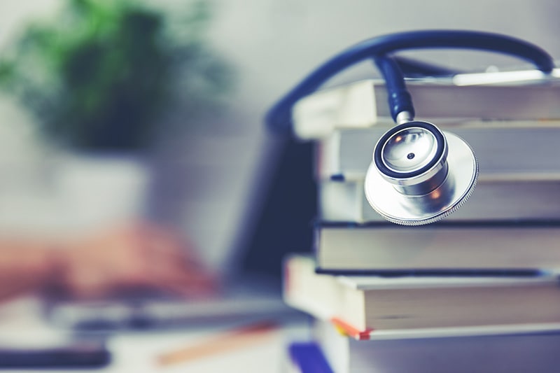 Stethoscope on medical school books