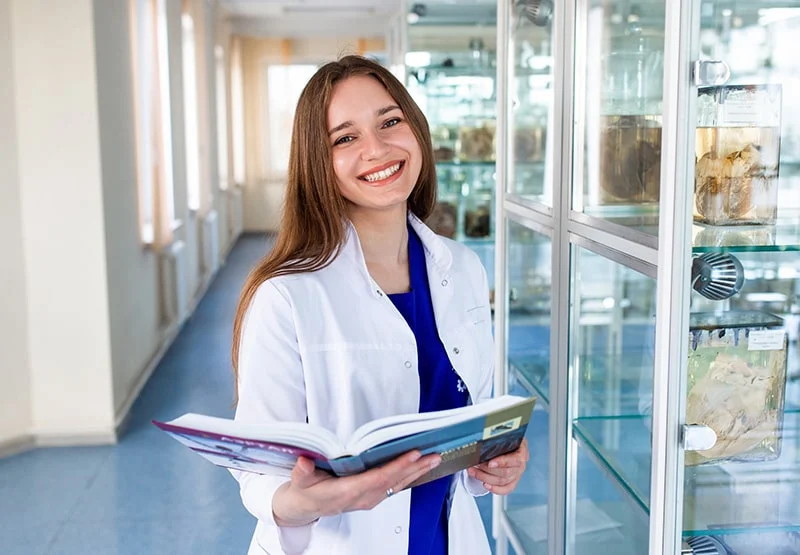 Medical student holding a book