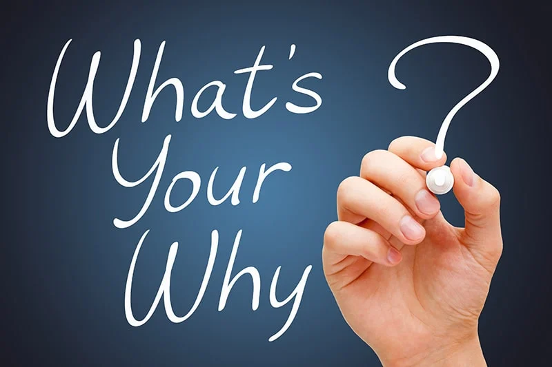 Hand writing 'What's your why?'