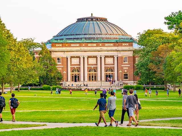 Students on a university campus lawn