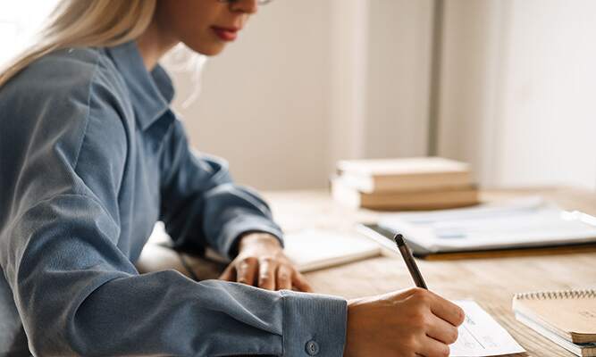 Student analyzing research notes