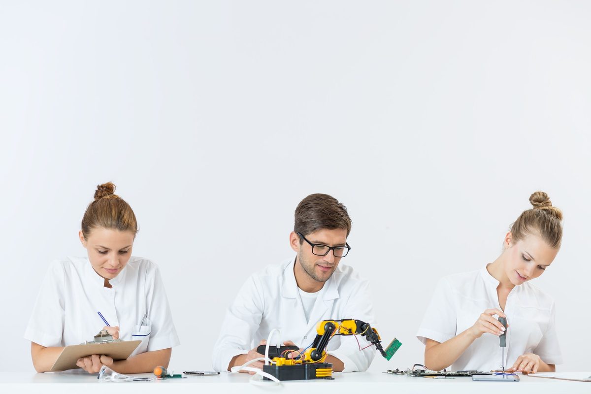 Students reviewing posters at an academic competition