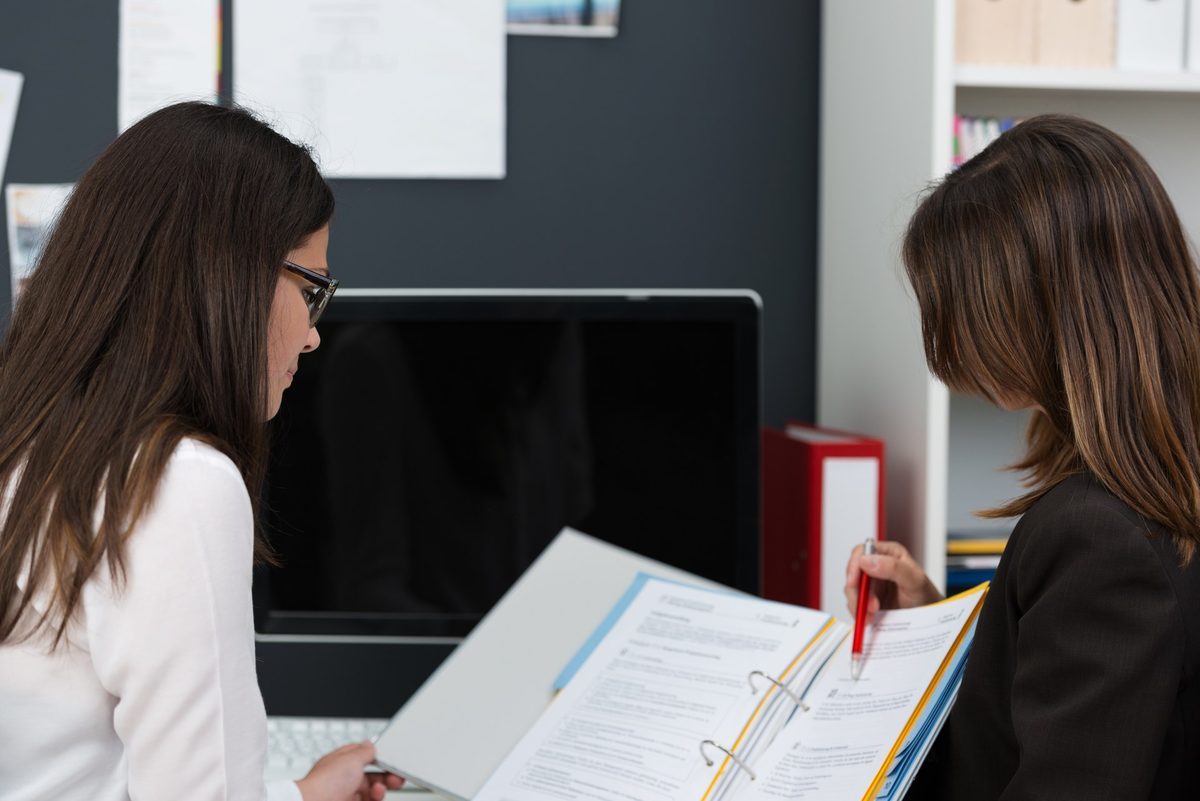 Counselor and students at a computer