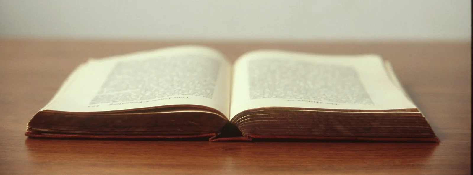 An open book on a wooden table