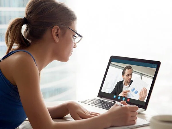 An online one-to-one lesson on a laptop