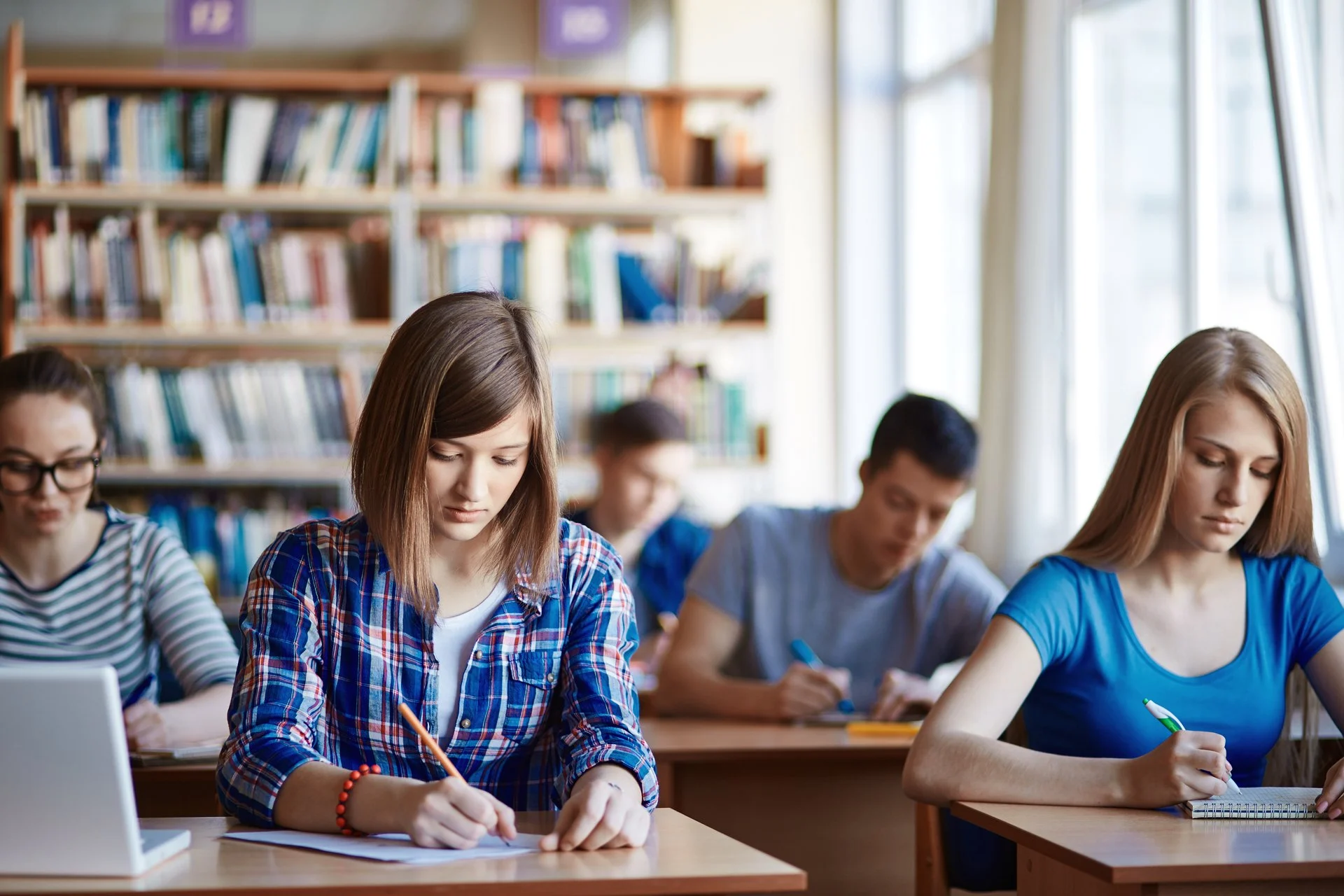 High school students studying in a school library