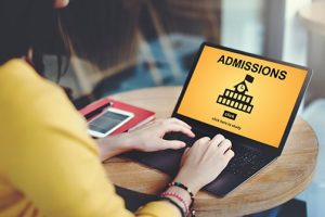 Student reviewing college admissions information on a tablet